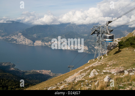 A cable car on the 2,218m summit of Mount Baldo above the medieval town of Malcesine on the eastern shore of Lake Garda from Monte Baldo, (Baldo mount Stock Photo