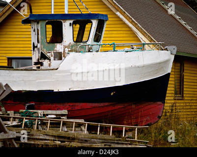 Beached fishingboat in old boatyard at Ballstad, Lofoten, northern Norway Stock Photo