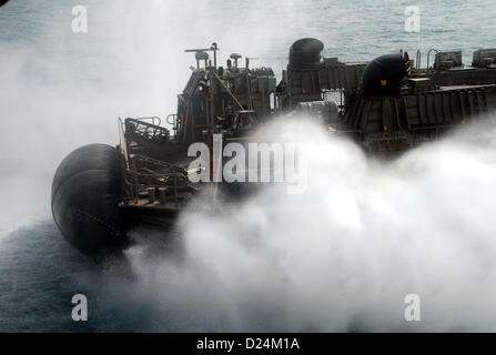 A landing craft, air cushion (LCAC) departs amphibious transport dock ship USS Green Bay (LPD 20).  Green Bay is part of the Peleliu Amphibious Ready Group and, with embarked 15th Marine Expeditionary Unit, is deployed in support of maritime security operations and theater security cooperation efforts in the U.S. 5th Fleet area of responsibility. Jan 14, 2013  (U.S. Navy photo) Stock Photo