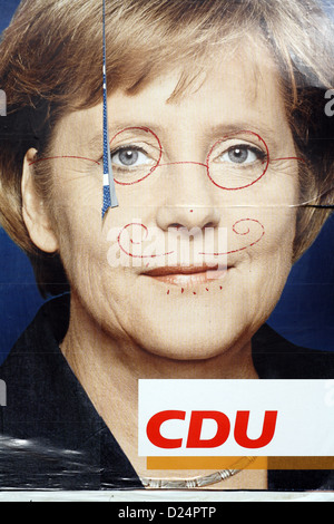 Berlin, Germany, scrawled CDU election poster with Angela Merkel Stock Photo