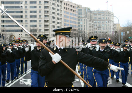 Master Sgt. William White, the U.S. Army Fife and Drum Corps' Senior Drum Major, gives movement commands to the unit during the presidential inaugural parade dress rehearsal on Pennsylvania Avenue, Jan. 13, 2013 . The soldier-musicians have been practicing for the parade, scheduled for Jan. 21, since October. Military involvement in the presidential inauguration dates back to April 30, 1789, when members of the U.S. Army, local militia units and revolutionary war veterans escorted George Washington to his first inauguration ceremony. (DoD Photo by Sgt. Katryn Tuton) (Released) Stock Photo