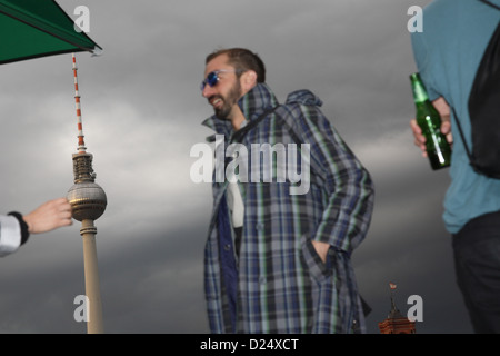 Berlin, Germany, attending a party, in the background of the TV tower Stock Photo