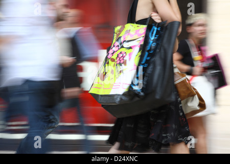 Berlin, Germany, women with shopping bags walking through a mall Stock Photo