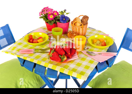 Eating outdoor in the garden with blue furniture Stock Photo