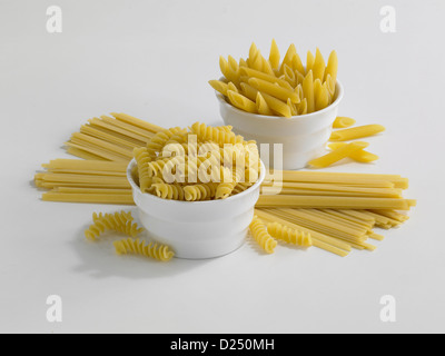 Assorted dry pasta outlined on white Stock Photo
