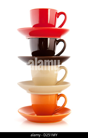 colorful cups and saucers isolated over white background Stock Photo
