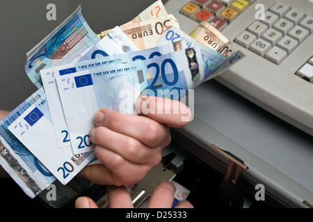 Berlin, Germany, money is taken out of the cash register Stock Photo