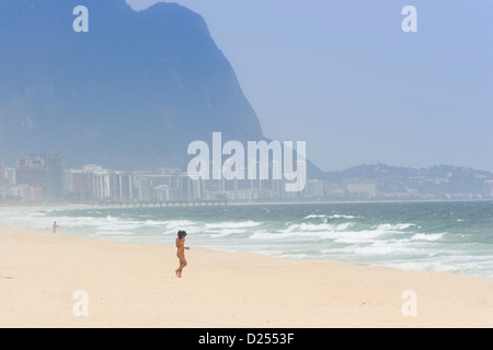 A young Carioca woman (from Rio) in a bikini on Pontal beach, Barra da Tijuca, Brazil Stock Photo