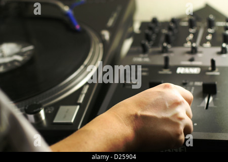 scratch battle of dj playing on his vinyls hand on Stock Photo