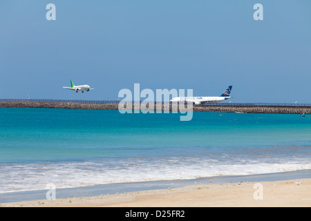 BALI - FEBRUARY 13. Landing planes Jimberan airport beach on February 13, 2012 in Bali, Indonesia. Stock Photo