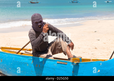 BALI - FEBRUARY 13. Line fishermen on Jimberan beach on February 13, 2012 in Bali, Indonesia. Stock Photo