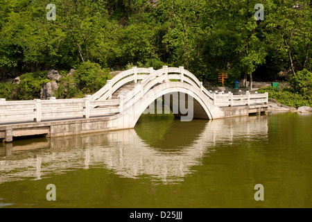 A bridge across the western lake in Xishan Park in Guilin in Southern China. Stock Photo