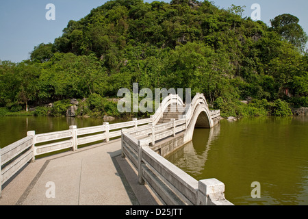 A bridge across the western lake in Xishan Park in Guilin in Southern China. Stock Photo