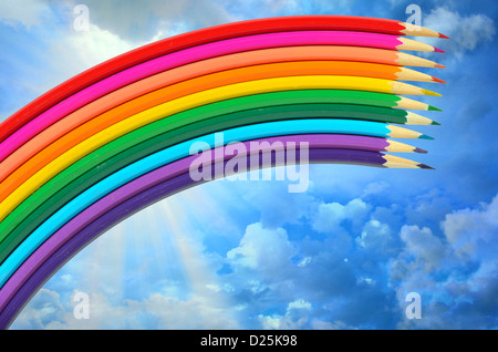 colored pencils and rainbow Stock Photo