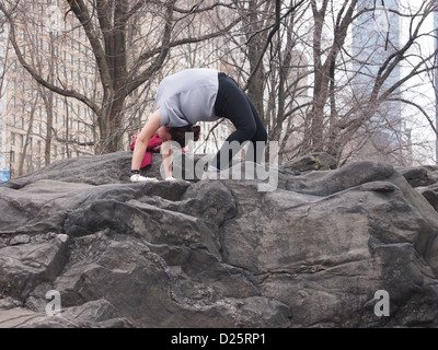 Girl doing yoga in park Stock Photo