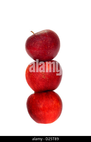 Three red apples stacked one on another isolated on white background Stock Photo