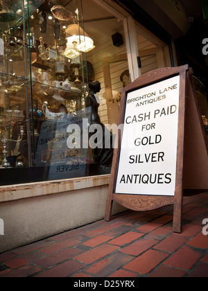 Sign in a Brighton Lanes jewellers which reads 'Cash Paid for Gold Silver Antiques' Stock Photo