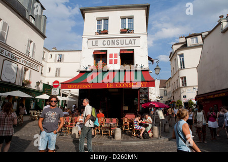 Le Consulat restaurant in Montmatre with exterior tables on the cobblestoned street, Paris, France Stock Photo