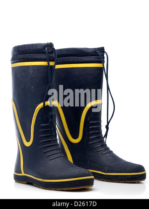 One pair of blue and yellow wellington boots isolated on white background Stock Photo