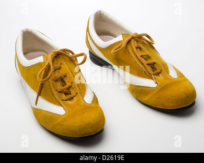 Pair of yellow flat shoes isolated on white background Stock Photo