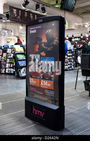 Poster advertising Dredd for sale at HMV Flagship store on Oxford Street, London. 239 HMV stores and over 4,000 jobs are in jeopardy after receivers Deloitte were called in to start administration proceedings.  Oxford Street, London UK. Stock Photo