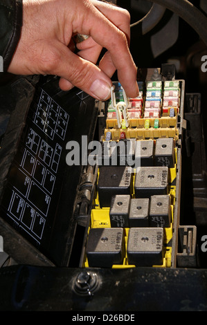 Car fuse box with fuses and relays. Car service Stock Photo - Alamy