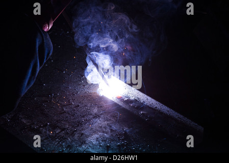The industrial process of MMA Stick welding used in boatyards, shipbuilding, heavy industry, fabrication of steel Stock Photo