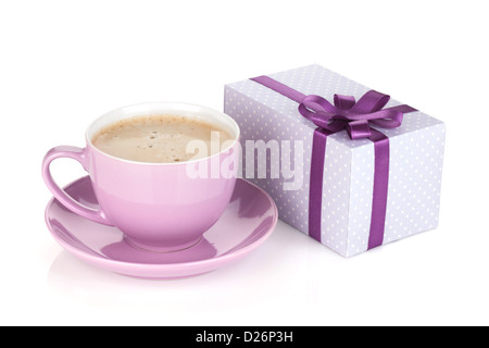 Purple coffee cup and gift box with bow. Isolated on white background Stock Photo