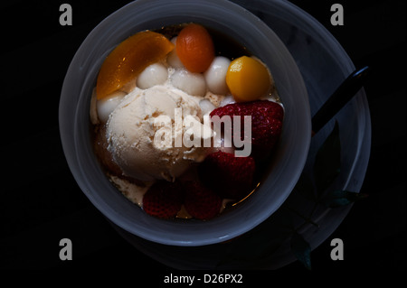 Anmitsu, a Japanese dessert of fruit, sticky rice cakes, chestnuts, and icecream. Stock Photo
