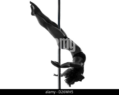 one  woman pole dancer dancing in silhouette studio isolated on white background Stock Photo