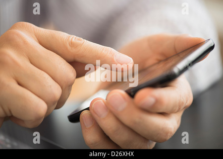 USA, New Jersey, Jersey City, Close-up of hands using smartphone Stock Photo