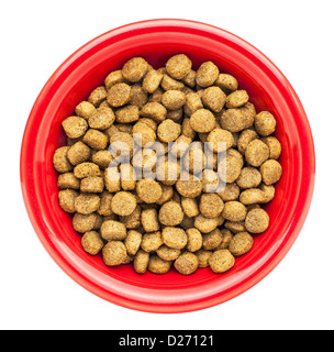 red bowl of dry dog food isolated on white Stock Photo