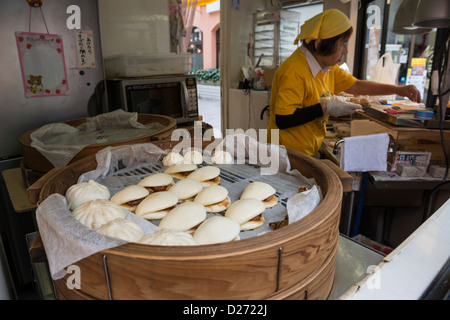 A Roadside Street Food Vendor Selling Steamed Pork Dumplings in Chinatown, Nagasaki, Japan Stock Photo
