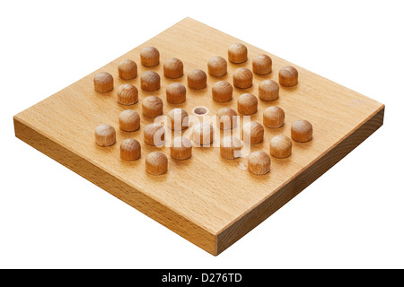 wooden peg solitaire board crafted from wood a popular indoor puzzle Stock Photo