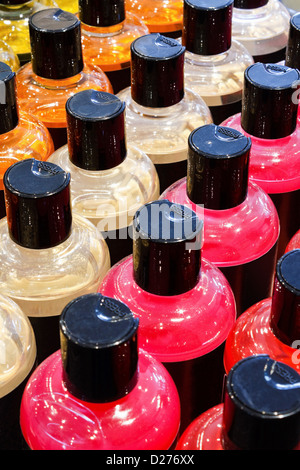 Luxury foam bath bottles in striking colours a popular pampering and beauty product Stock Photo