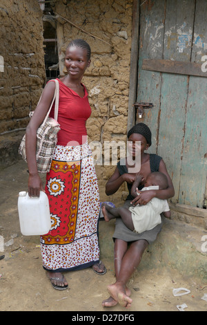 KENYA Scenes in the slum of Bangladesh. Mombasa.  Women and a baby being breastfed. photo by Sean Sprague Stock Photo