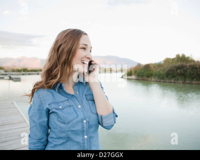 USA, Utah, Salt Lake City, Portrait of young woman talking on phone Stock Photo