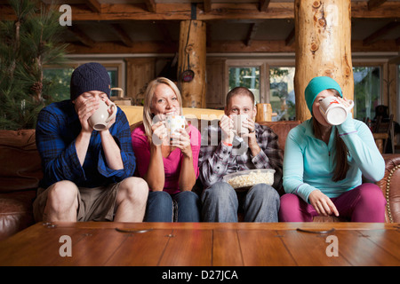 USA, Utah, Salt Lake City, Friends drinking tea in log cabin Stock Photo