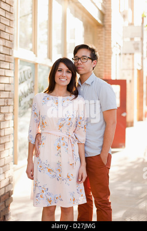 USA, Utah, Salt Lake City, Portrait of couple standing on sidewalk Stock Photo