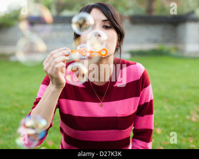 USA, Utah, Salt Lake City, Woman blowing bubbles Stock Photo