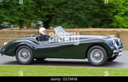 1949 Jaguar XK120 with driver Sir Stirling Moss at the 2012 Goodwood Festival of Speed, Sussex, UK. Stock Photo