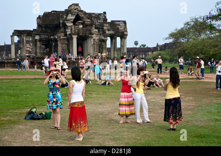 Japanese tourists taking snapshots. Angkor Wat. Cambodia Stock Photo