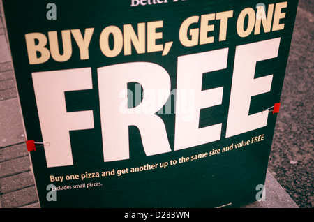 'Buy One Get One Free' advertisement outside a pizza takaway, London, England Stock Photo