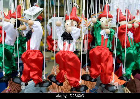 A display of Pinocchio puppets on sale in a souvenir shop in Sirmione, a fortified medieval town on the southern tip of Lake Garda in the province of Stock Photo