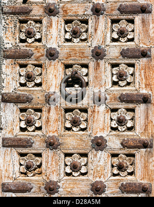 Old wooden door with floral decoration. Fragment. Rajasthan,India Stock Photo