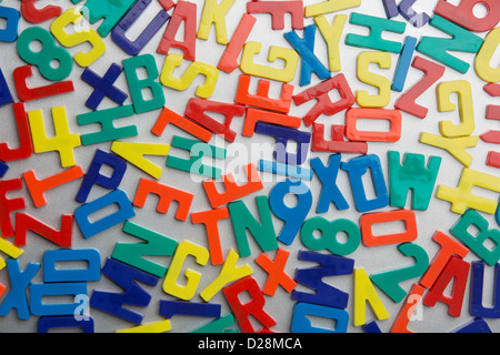 Refrigerator magnet letters jumbled up in a random pattern Stock Photo