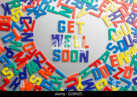 'Get Well Soon' - Refrigerator magnets spell a message out of a jumble of letters Stock Photo