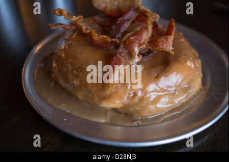 Bacon maple syrup donut at Gourdough's in Austin, Texas Stock Photo