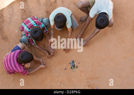 Indian boys playing marbles in a rural Indian village. Andhra Pradesh, India Stock Photo