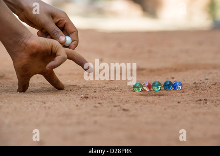 Indian boys playing marbles in a rural Indian village. Andhra Pradesh, India Stock Photo